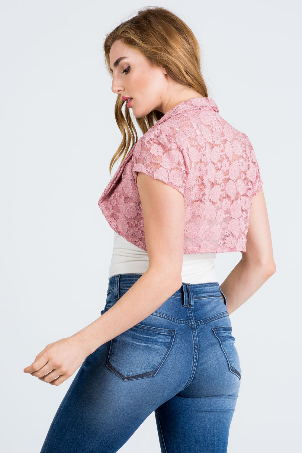 Crochet lace cropped shrug with open front and cap sleeves.