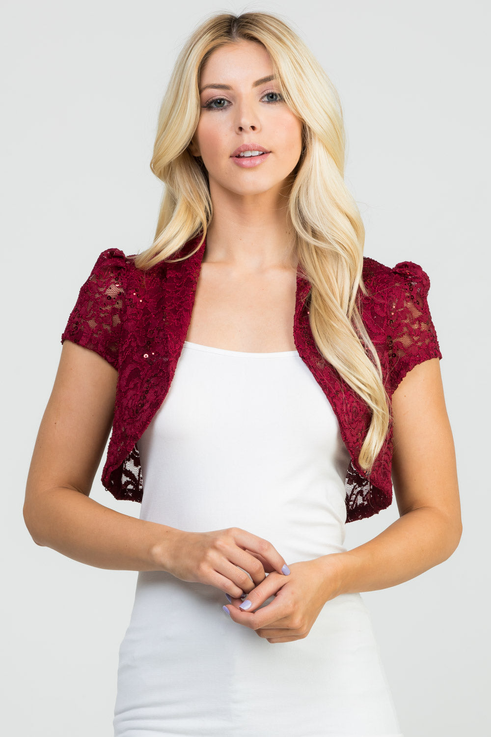 Crochet sequin lace cropped shrug with open front and cap sleeves.