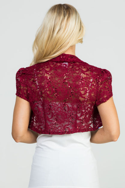 Crochet sequin lace cropped shrug with open front and cap sleeves.