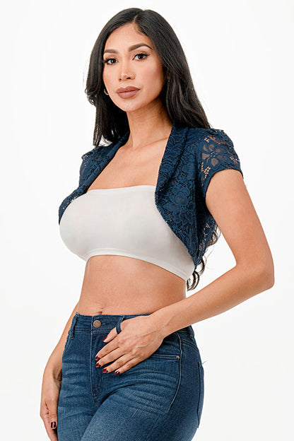 Crochet lace cropped shrug with open front and cap sleeves.
