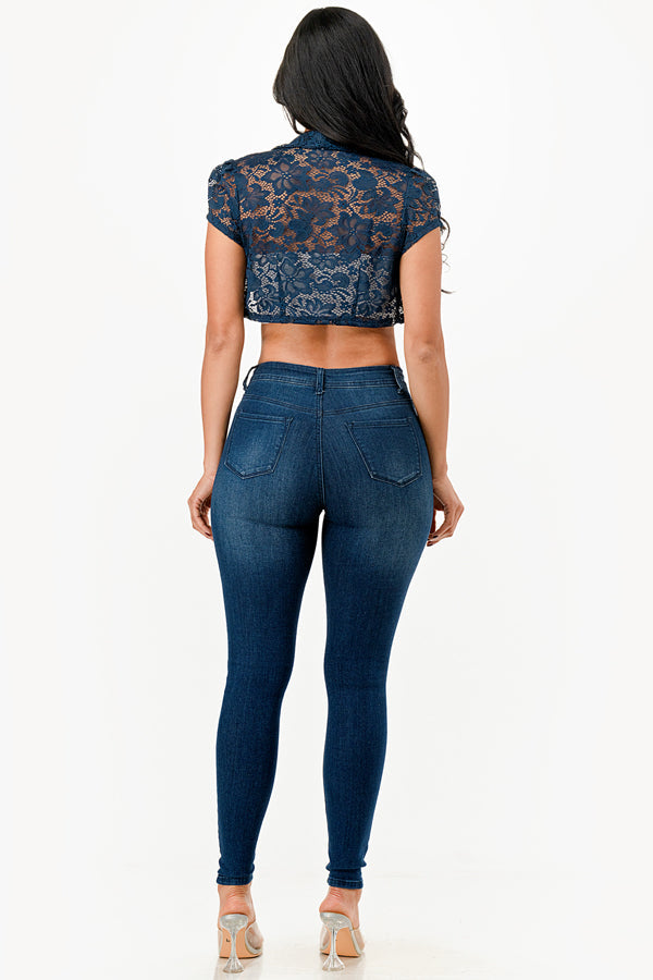 Crochet lace cropped shrug with open front and cap sleeves.