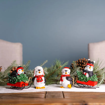 Playful Penguins with Sled Figurine