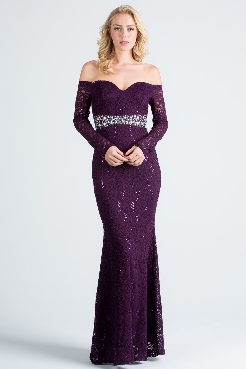 Off the shoulder long sleeve sweetheart sequin lace gown with waist embellishment.