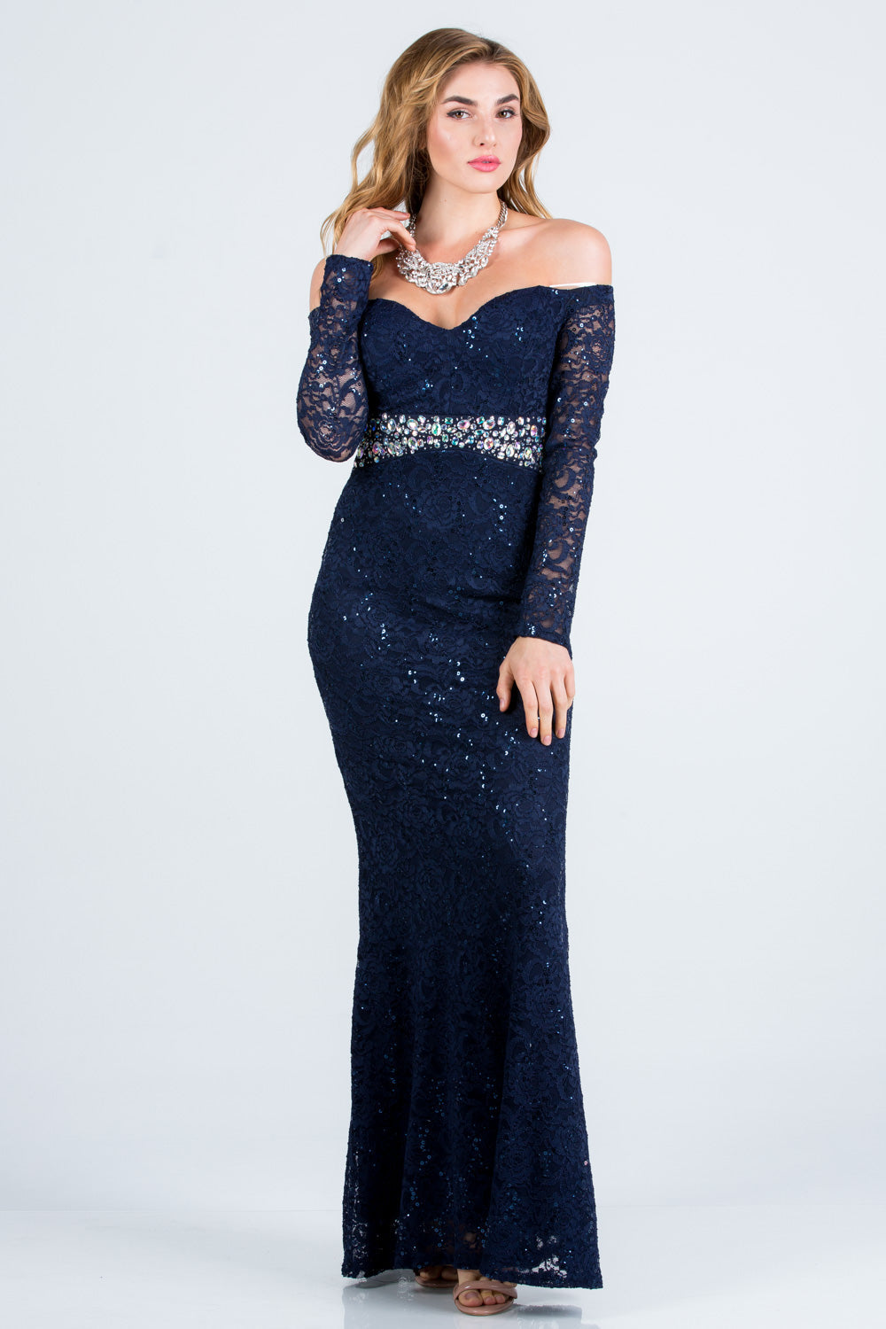 Off the shoulder long sleeve sweetheart sequin lace gown with waist embellishment.