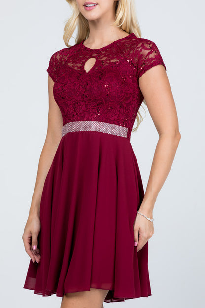 Lace and wool dobby, cap sleeve, fit and flare dress with waist embellishment.