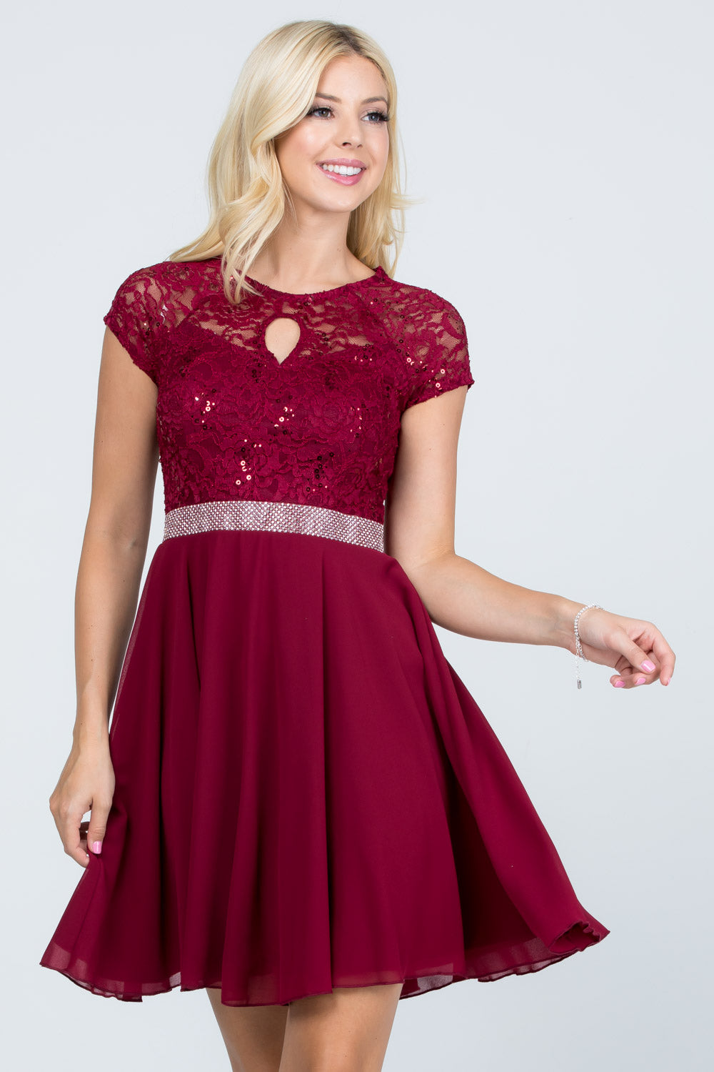 Lace and wool dobby, cap sleeve, fit and flare dress with waist embellishment.