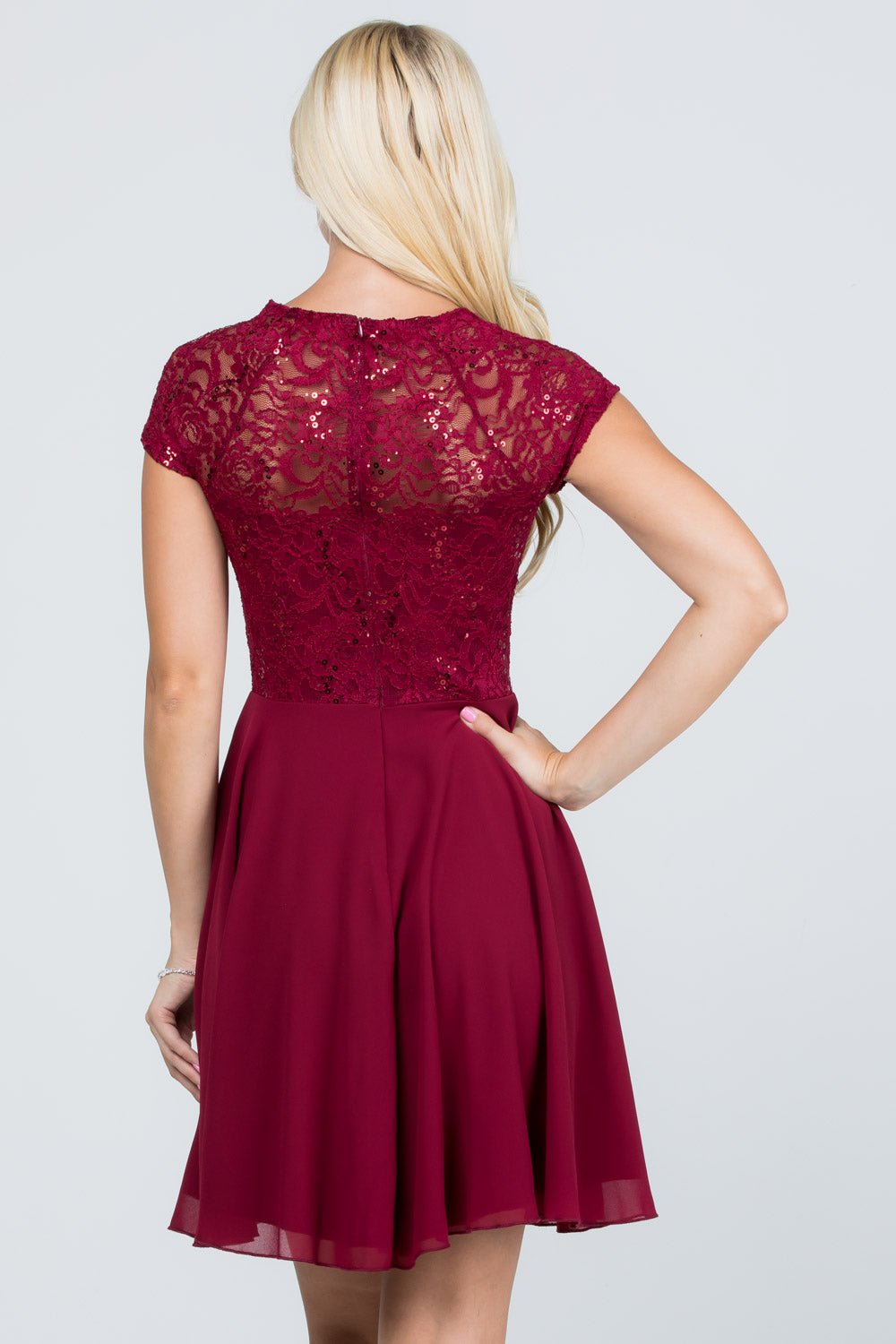 Lace and wool dobby, cap sleeve, fit and flare dress with waist embellishment.