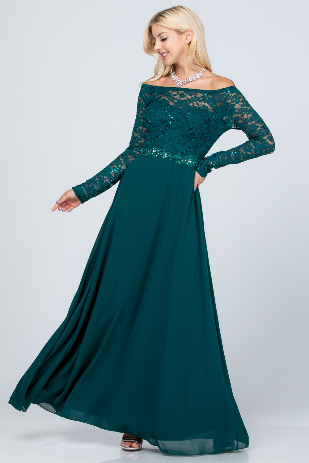 Long sleeve lace and chiffon A-line gown with waist lace embellishment.