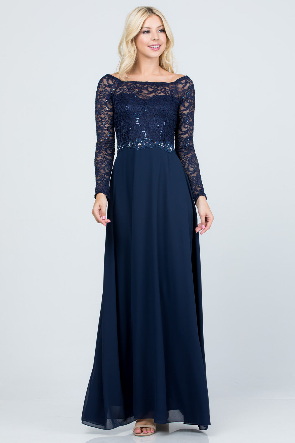 Long sleeve lace and chiffon A-line gown with waist lace embellishment.
