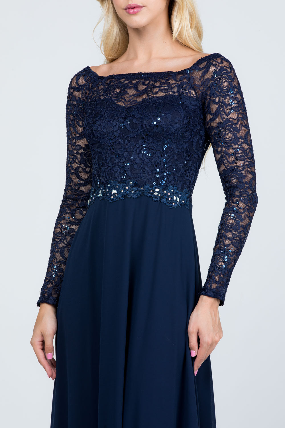 Long sleeve lace and chiffon A-line gown with waist lace embellishment.