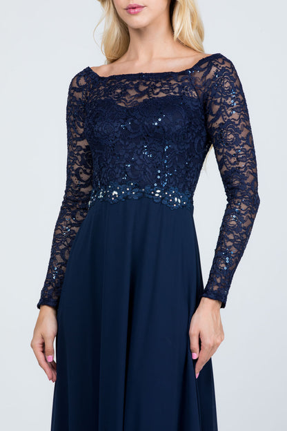 Long sleeve lace and chiffon A-line gown with waist lace embellishment.