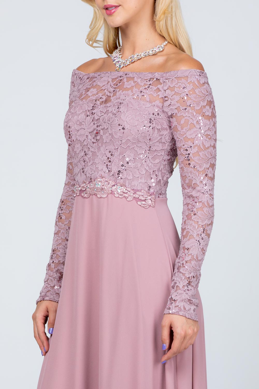 Long sleeve lace and chiffon A-line gown with waist lace embellishment.