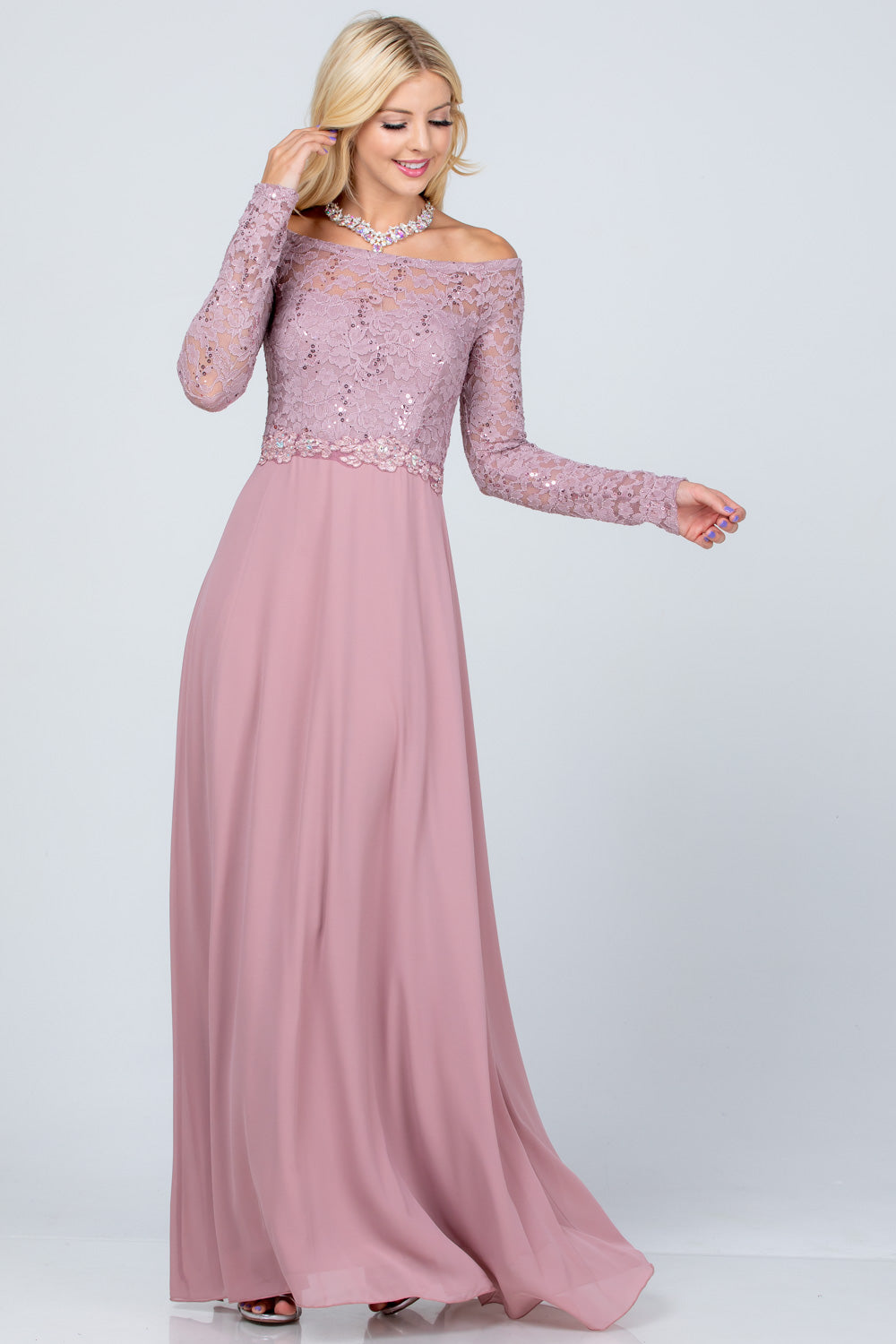 Long sleeve lace and chiffon A-line gown with waist lace embellishment.