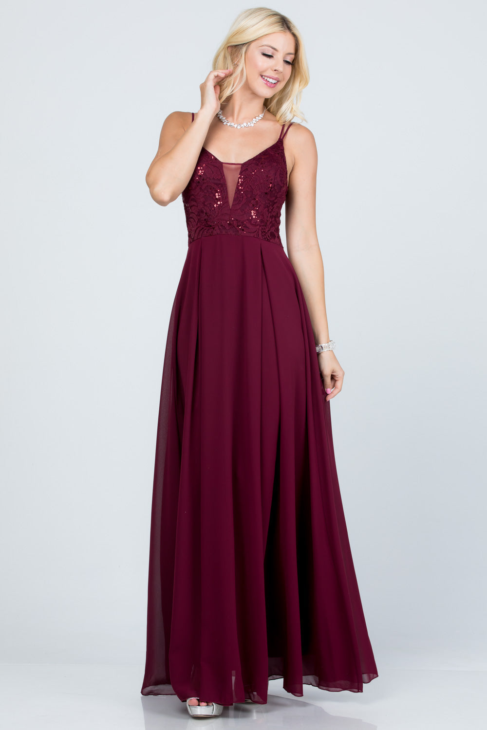 Full length double spaghetti strap sequin lace and chiffon dress with mesh insert on the front. Young contemporary for prom, homecoming graduation or cocktail events