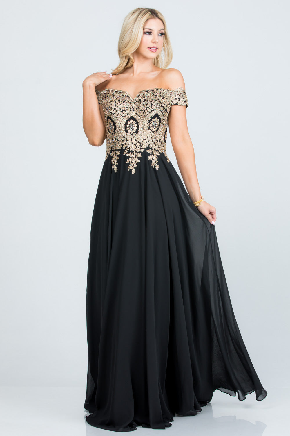 Off the shoulder chiffon gown embellished with gold lace appliques