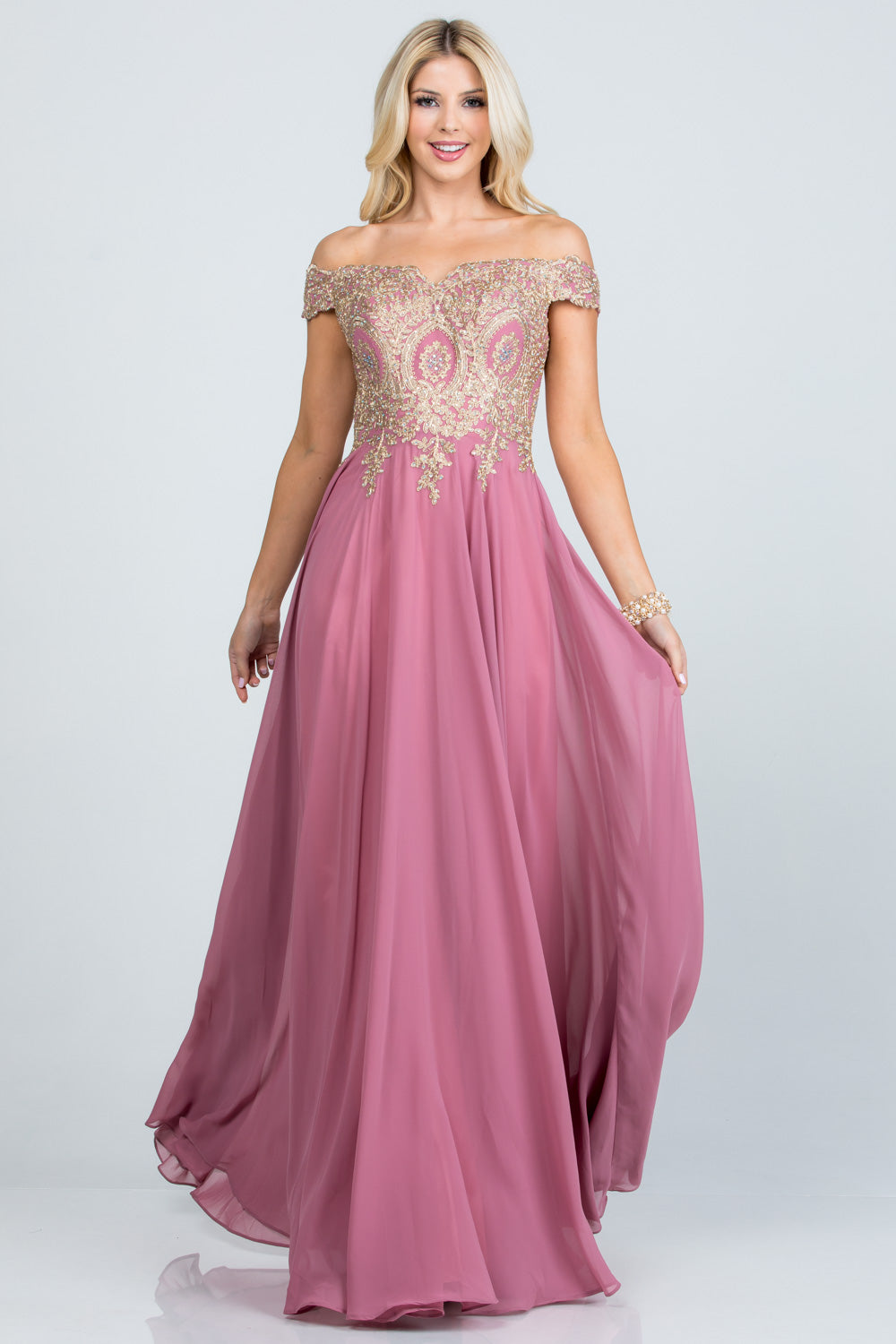 Off the shoulder chiffon gown embellished with gold lace appliques