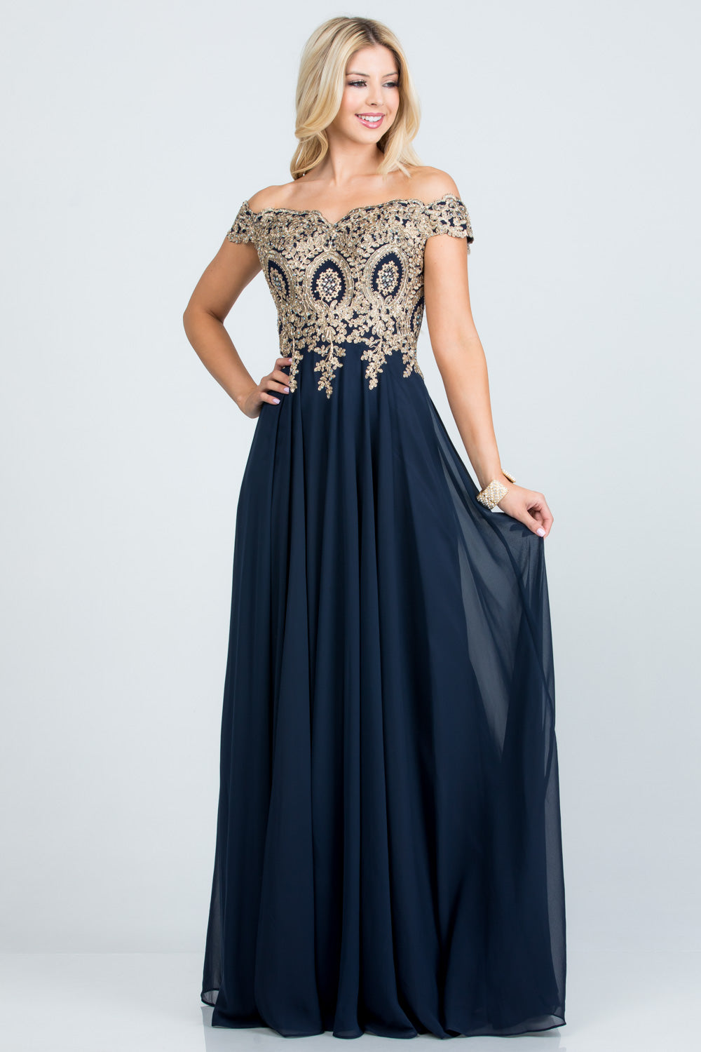 Off the shoulder chiffon gown embellished with gold lace appliques