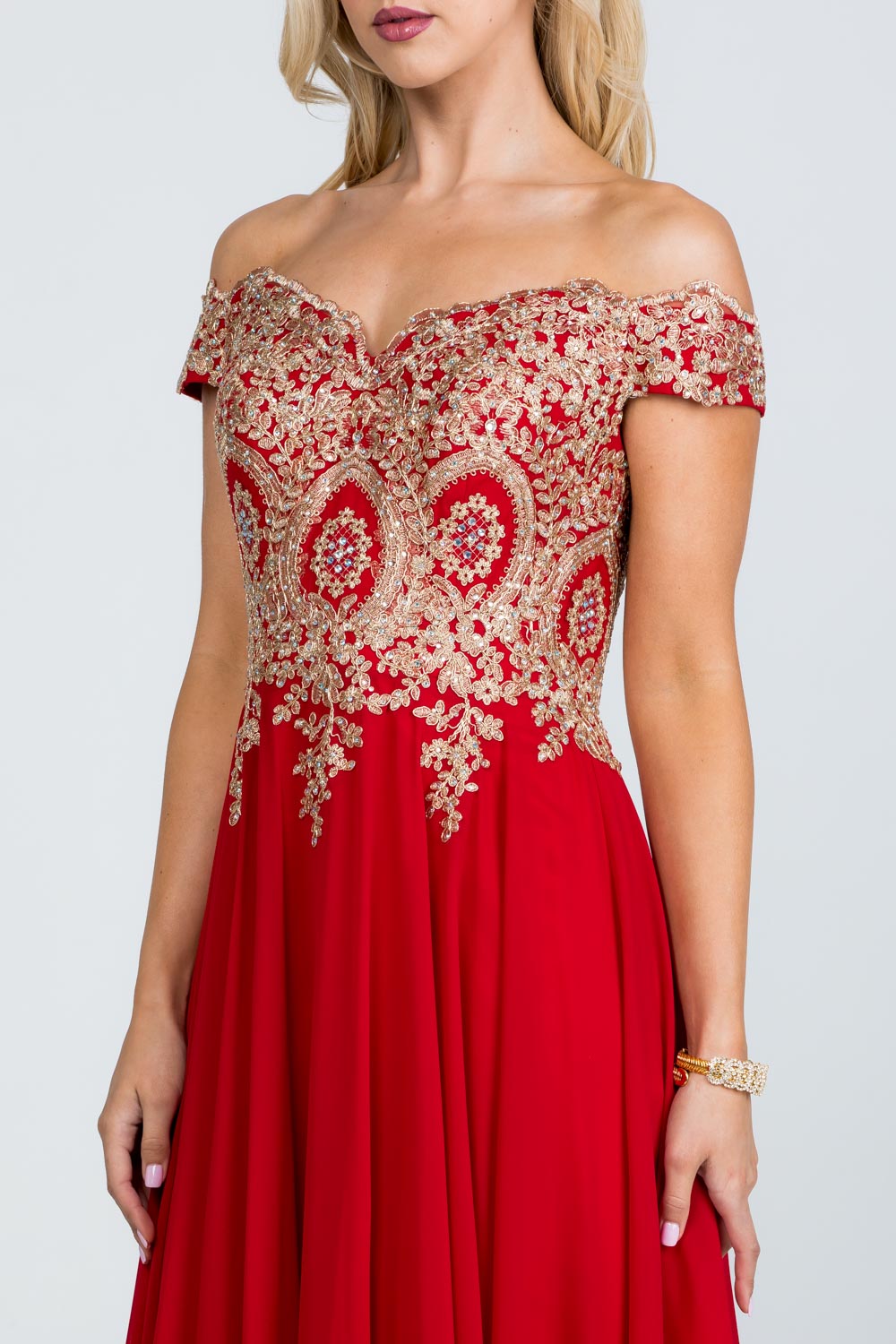 Off the shoulder chiffon gown embellished with gold lace appliques
