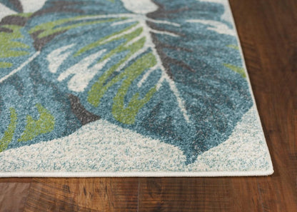 7' X 10' Beige Teal And Green Tropical Botanical Area Rug