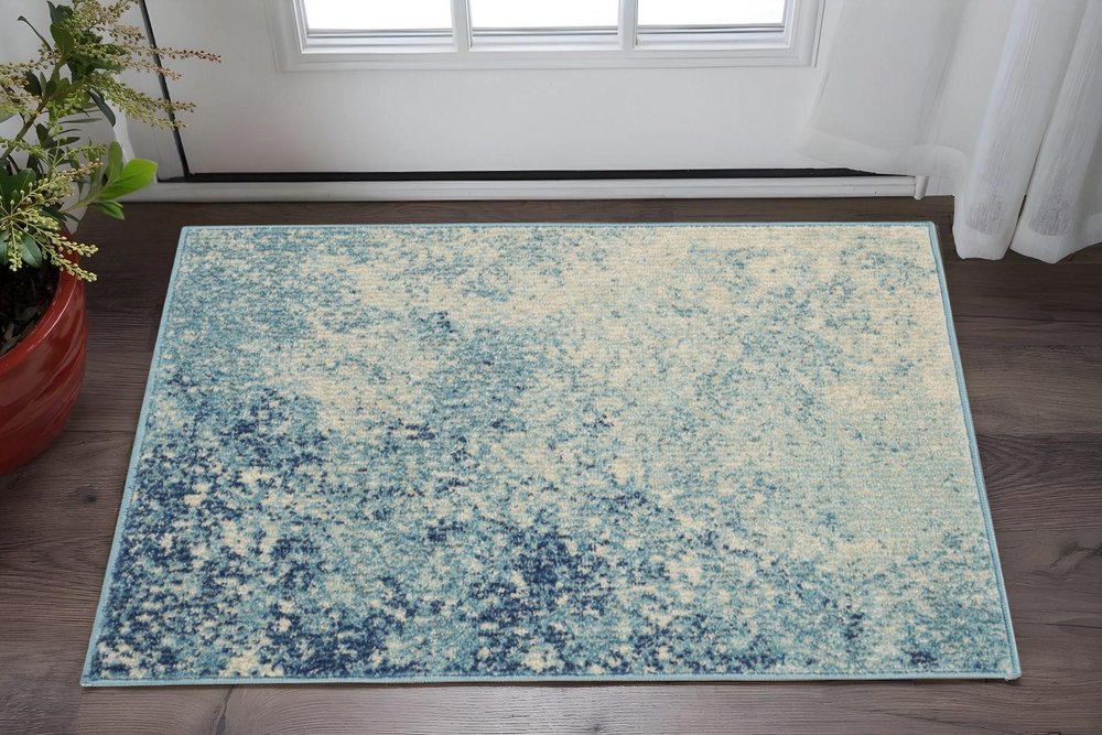 5' X 7' Blue And Ivory Abstract Area Rug