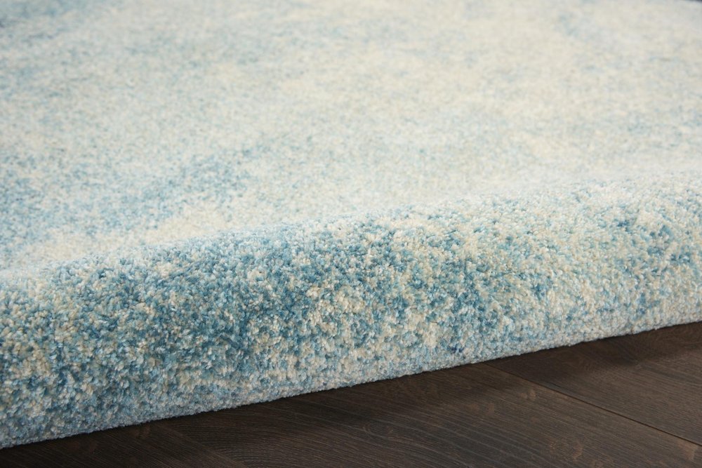 5' X 7' Blue And Ivory Abstract Area Rug