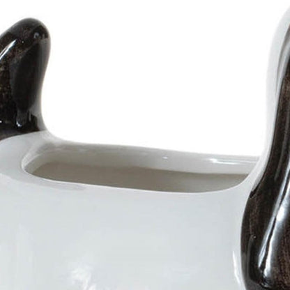 Set of Four Black And White Polyresin Dog Planters