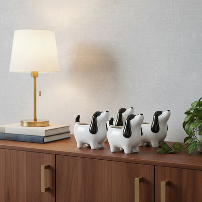 Set of Four Black And White Polyresin Dog Planters