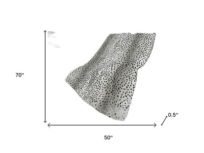 50" X 70" Pearl And Black Animal Print Polyester Woven Plush Throw Blanket