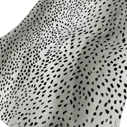 50" X 70" Pearl And Black Animal Print Polyester Woven Plush Throw Blanket