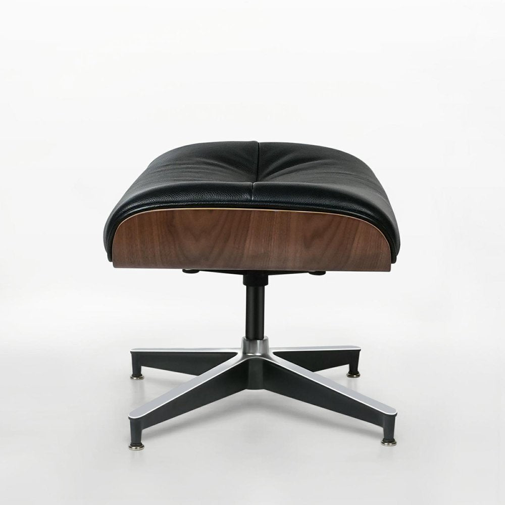 33" Black and Walnut Leather And Wood Swivel Lounge Chair With Ottoman